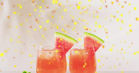 Image of confetti falling and cocktails on white background. Party, drink, entertainment and celebration concept digitally generated image.の写真素材