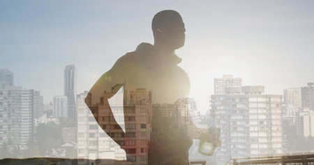 Image of glowing lights over an exercising african american man drinking water. Global connections, wellbeing, fitness and healthy lifestyle concept digitally generated image.の写真素材