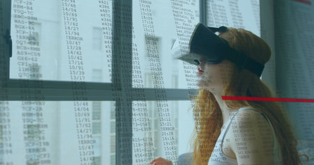 Image of woman in vr headset by window with interface and fast scrolling digital information....