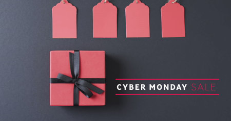 Image of cyber monday sale text over gift boxes. Sales, retail, cyber shopping, digital interface, communication, computing and data processing concept digitally generated image.の写真素材