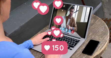 Person engages in a video call, floating hearts indicating affection. The scene suggests a virtual...
