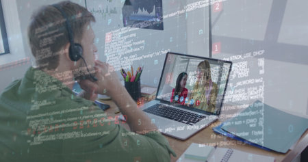 Caucasian man with headset works on a laptop, code overlay. A reflection shows a Caucasian woman and...