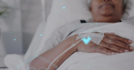 Image of network of medical icons and data processing over african american female patient. Global science, medicine, research, computing and data processing concept digitally generated image.の写真素材