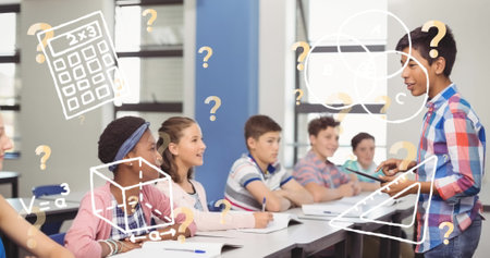 Image of school icons over diverse schoolchildren in classroom. school and education concept...