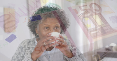 Image of senior woman drinking tea over euro currency bills. retirement and finances concept...
