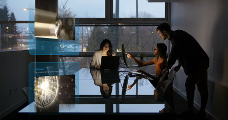 Image of social media posts over diverse business people using computers. Global social media and...