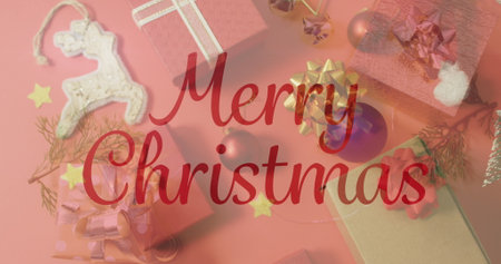 Image of christmas greetings text over christmas presents and decorations. Christmas, festivity,...