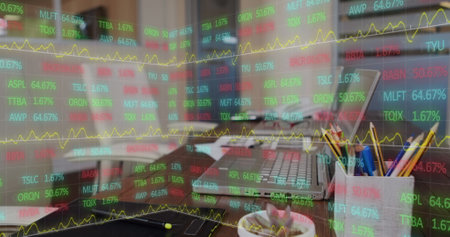 Image of statistics and data processing over laptop. Global business, finance and data processing concept digitally generated image.の写真素材