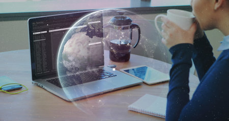Image of data processing and globe over caucasian businesswoman using laptop. Computer security day...
