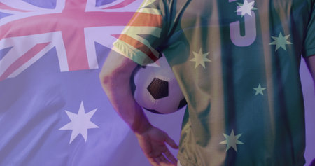 Image of caucasian male soccer player over flag of australia. Global patriotism, celebration, sport and digital interface concept digitally generated image.の写真素材