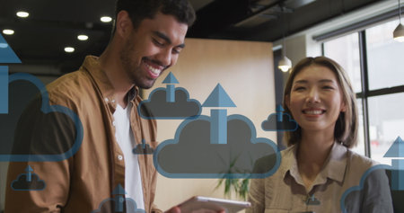 Image of clouds with arrows icons over diverse business people smiling and talking. global networks,...