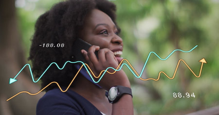 Image of data processing over african american woman using smartphone. Global business, finances and...