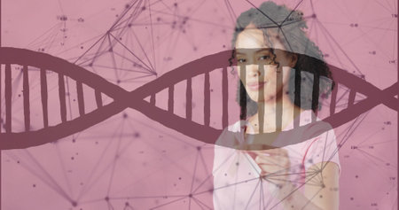 Image of dna strand and data processing over african american woman holding pink ribbon. Global science, medicine, healthcare, lifestyle and digital interface concept digitally generated image.の写真素材