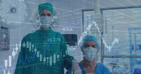 Image of statistics and data processing over diverse surgeons. Global medicine, connections, computing and data processing concept digitally generated image.の写真素材