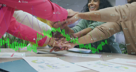 Image of financial data processing over diverse business people in office. Global finance, business, connections, computing and data processing concept digitally generated image.の写真素材
