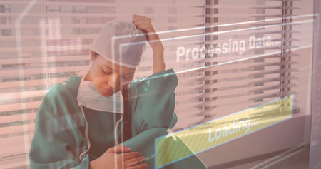 Processing data and loading image over tired healthcare worker in hospital. medical, stress, data analysis, technology, exhaustion, nurseの写真素材