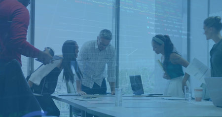 Image of financial data processing over diverse business people using laptop. Global finance,...