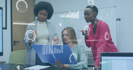 Image of financial data processing over diverse colleagues discussing work in office. Global business, finances, computing and digital interface concept digitally generated image.の写真素材
