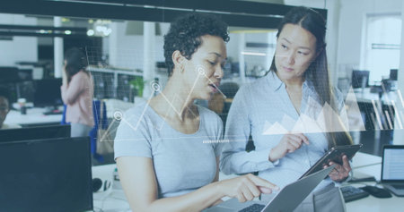 Image of financial data processing over diverse colleagues discussing work in office. Global business, finances, computing and digital interface concept digitally generated image.の写真素材