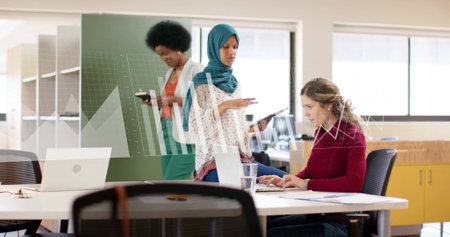 Image of financial data processing over diverse business people in office. Global finance, business, connections, computing and data processing concept digitally generated image.の写真素材