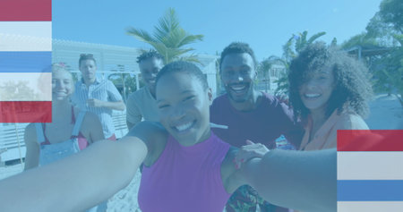 Image of red, white and blue stripes over happy diverse friends taking selfie on sunny beach. Friendship, america, summer, togetherness, fun, free time and vacations, digitally generated image.の写真素材