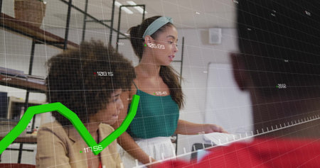 Image of financial data processing over diverse colleagues having meeting in office. Global finances, business and digital interface concept digitally generated image.の写真素材