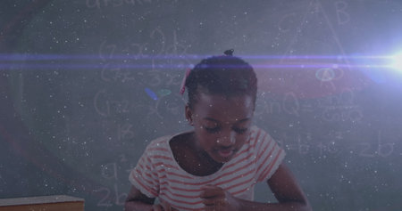 Image of biracial schoolgirl reading a book during lesson at school with equations floating around her. Education back to school and schooling concept digital composite.の写真素材