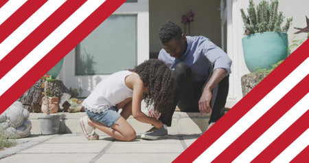 Image of flag of united states of america over african american father and daughter having fun. american patriotism and independence concept digitally generated image.の写真素材