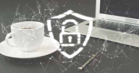 Image of padlock icon and network of connections over laptop and coffee. Global technology, online security and digital interface concept digitally generated image.の写真素材