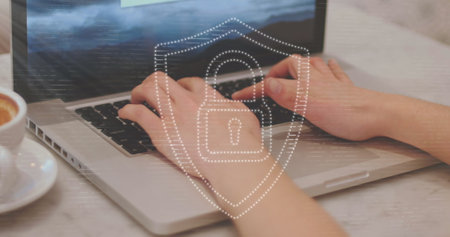 Image of padlock icon and light trails over hands using laptop. Global technology, online security...