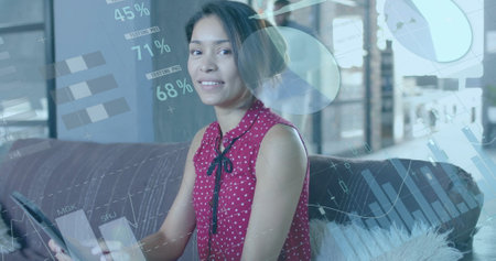 Image of financial data processing over biracial businesswoman in office. Global finance, business,...