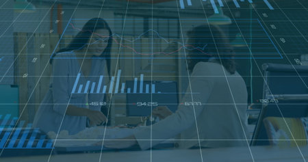 Financial data charts image over business people working in office. Finance, data analysis,...
