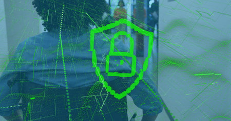 Cybersecurity shield image over people working in office environment. Technology, protection, digital, data, safety, teamworkの写真素材