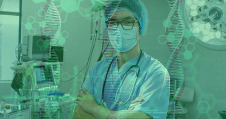 Image of data processing and dna strands over asian male surgeon with face mask. Technology, medicine and digital interface concept digitally generated image.の写真素材