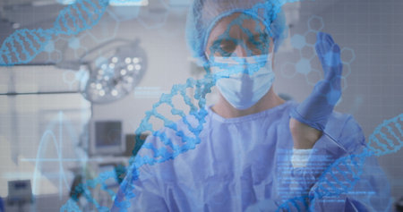 Image of data processing and dna strands over caucasian male surgeon with face mask. Technology, medicine and digital interface concept digitally generated image.の写真素材