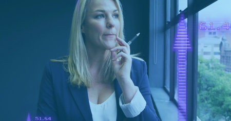 Holding pen and thinking, woman with data visualization image over her face. Business, analytics,...