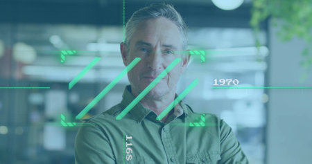 Green digital interface image over man standing in modern office. Technology, innovation, futuristic, business, workplace, hologramの写真素材