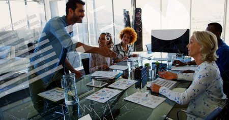 Image of financial data processing over diverse business people in office. Global finance, business, connections, computing and data processing concept digitally generated image.の写真素材