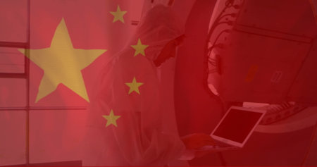 Scientist working on laptop over Chinese flag image. Technology, science, research, innovation, laboratory, analysisの写真素材
