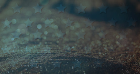 Image of american flag stars over sparkling sand falling in background. Patriotism concept digitally generated image.の写真素材