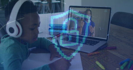 Image of padlock icon and data processing over african american boy having online lesson. global technology, connections and digital interface concept digitally generated image.の写真素材