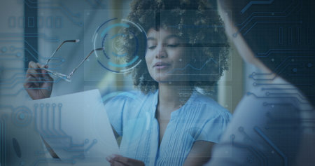 Image of scope scanning and data processing over diverse businesswomen. global technology, connections and digital interface concept digitally generated image.の写真素材