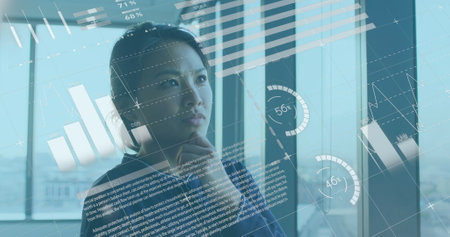 Image of statistical data processing against thoughful asian woman working at office. Computer interface and business data technology conceptの写真素材