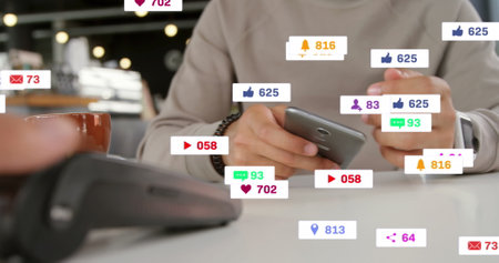 Image of notification bars over caucasian man using cellphone and credit card reader on table....