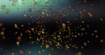 Image of orange and yellow orbs over green flashing lights on dark background. Shape, colour and...