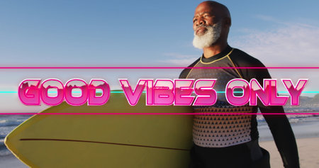 Image of good vibes only text with african american man holding surfboard. retro communication and social media concept digitally generated image.の写真素材