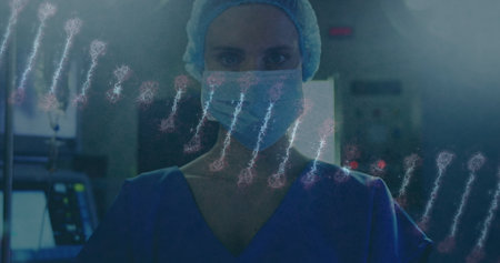 Image of dna strand over female caucasian surgeon with face mask. global research and medicine during covid 19 pandemic concept digitally generated image.の写真素材