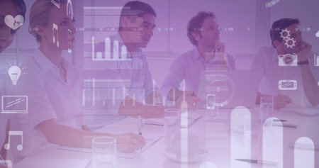 Image of graphs and icons over diverse businesspeople in office. business, network, connections and technology concept digitally generated image.の写真素材