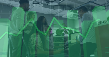Statistical data processing over group of diverse office colleagues discussing together at office. Business data and analytics technology conceptの写真素材