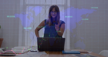 Image of data processing over caucasian businesswoman using laptop. Global business and digital...